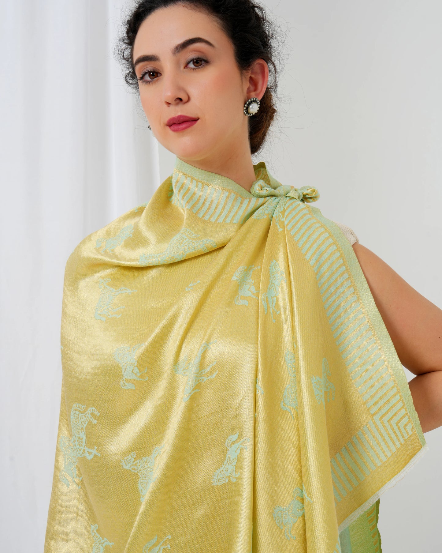 Woolen stole in gold and lime green with horse motifs