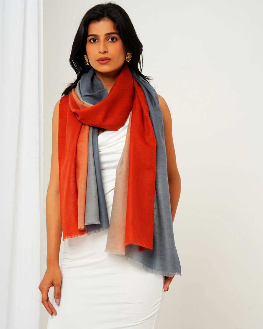 Woman wearing a colorful scarf with a white background