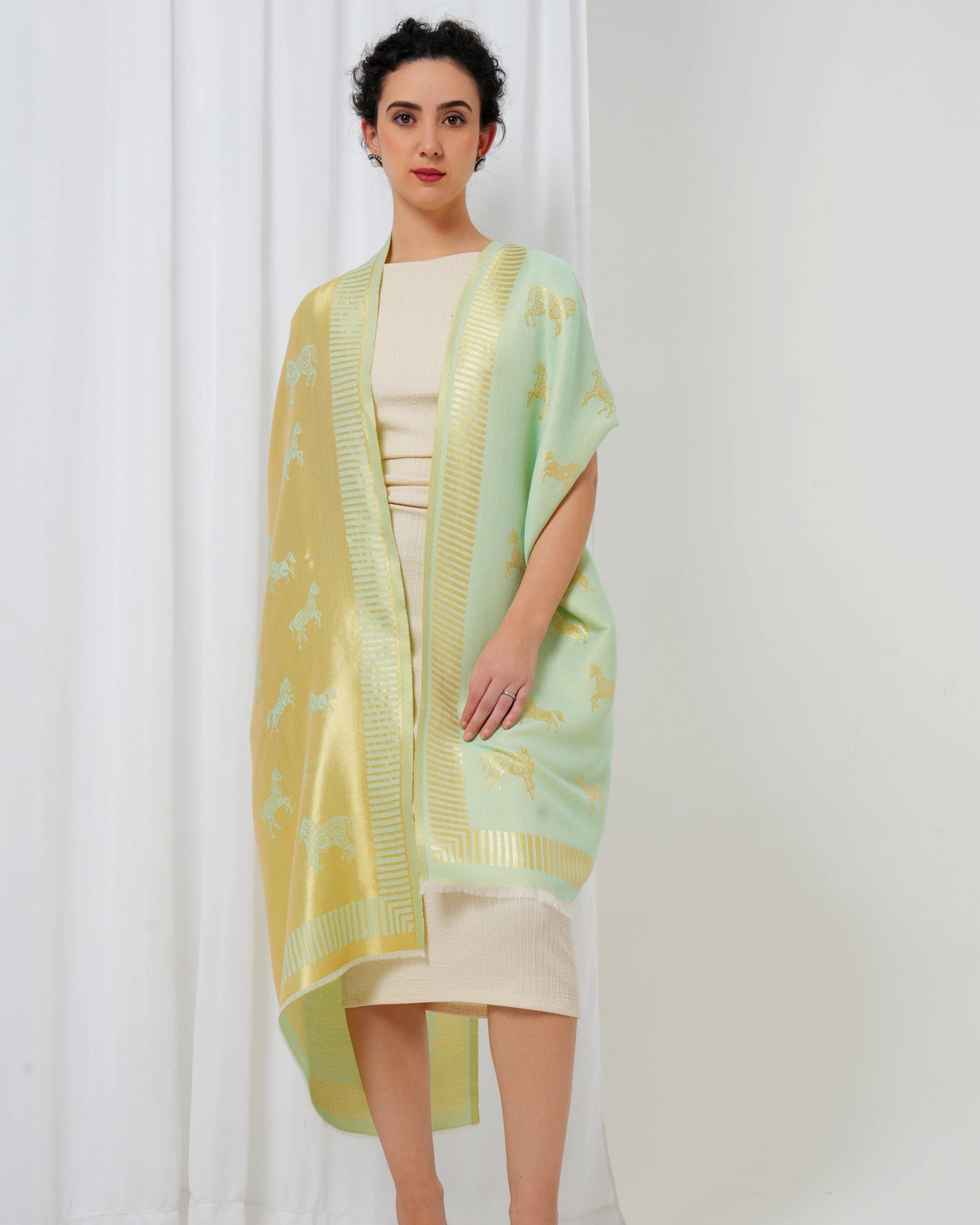 Woolen stole in gold and lime green with horse motifs