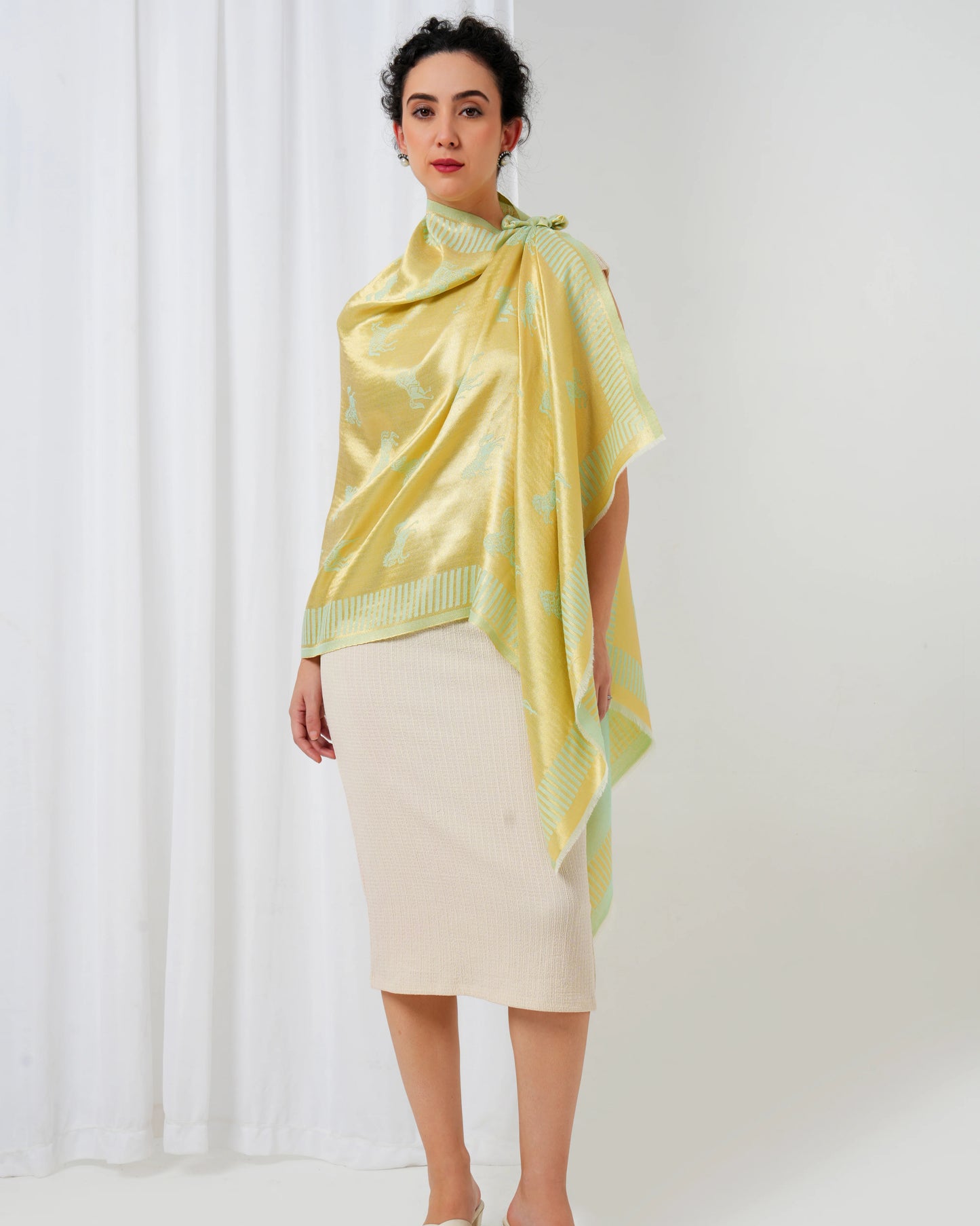 Woolen stole in gold and lime green with horse motifs