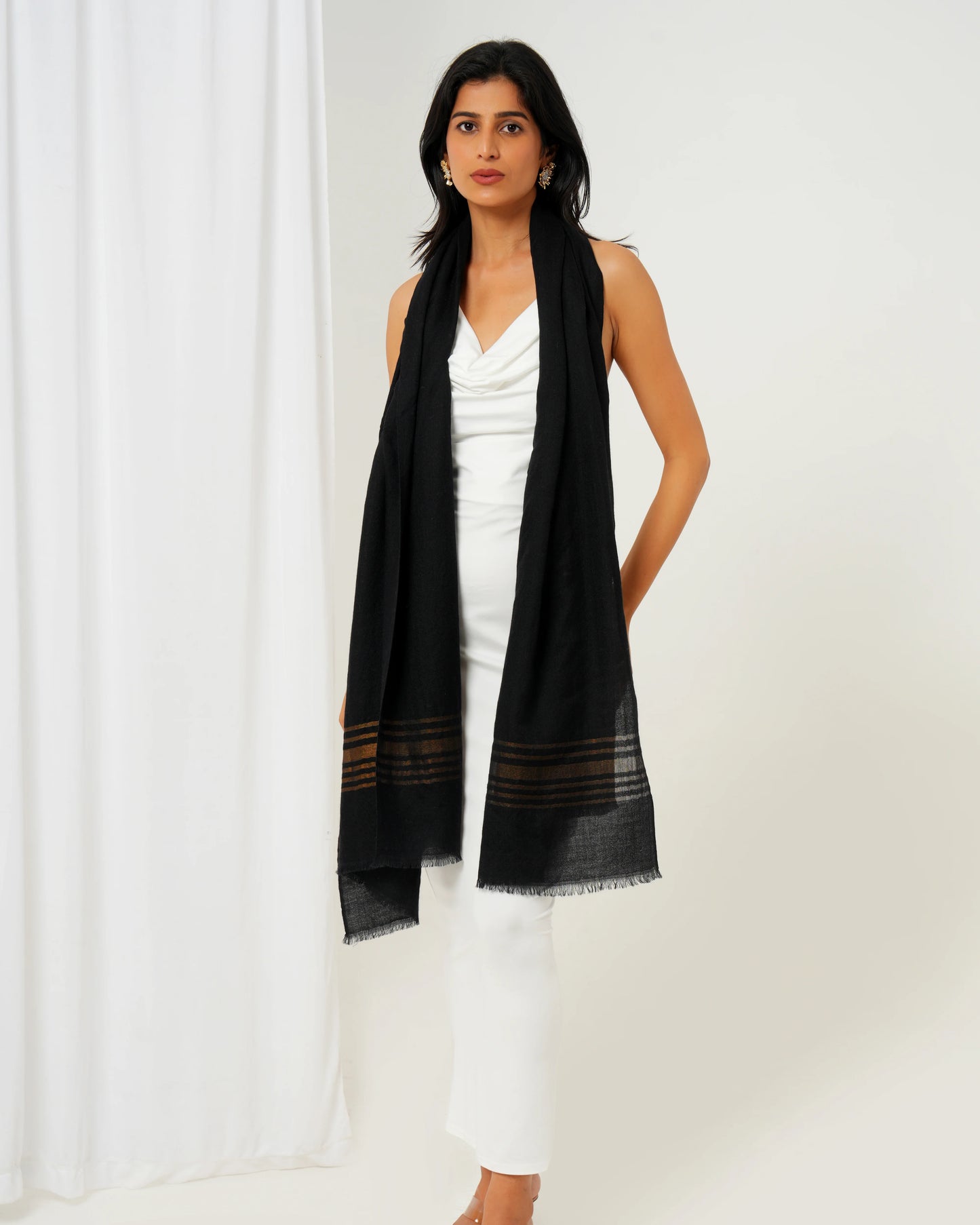 Cashmere stole in black base with golden stripes