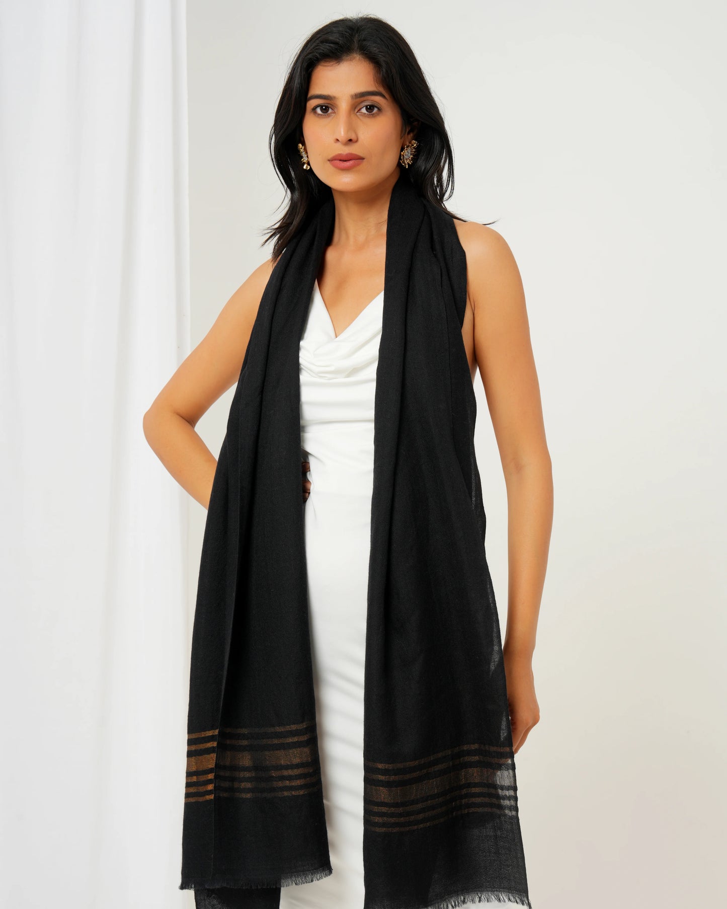 Cashmere stole in black base with golden stripes