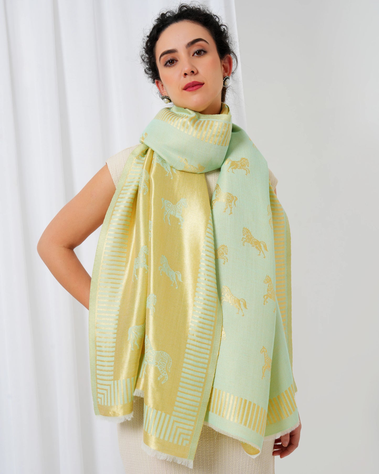 Woolen stole in gold and lime green with horse motifs
