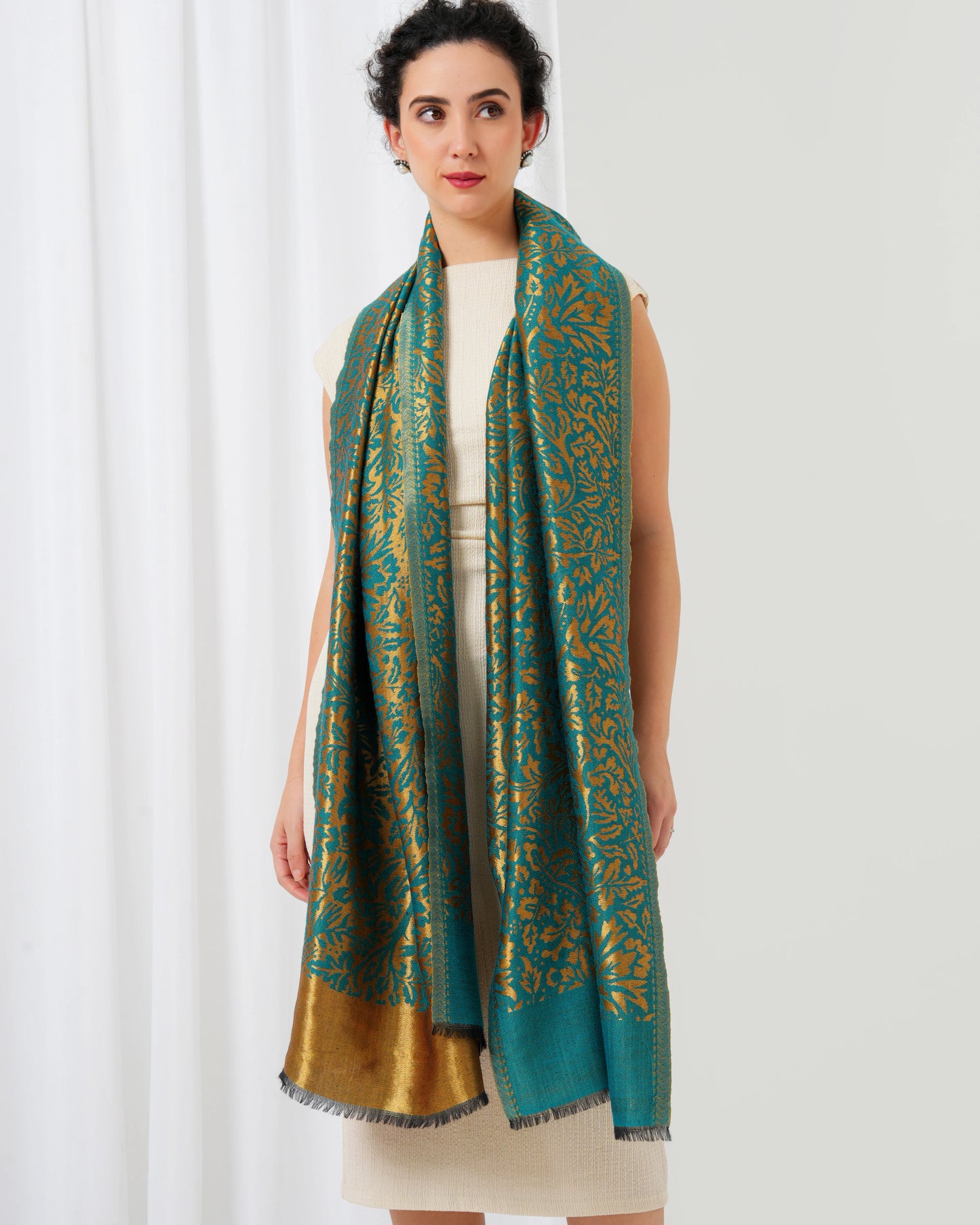 Wool stole with teal blue base with golden design