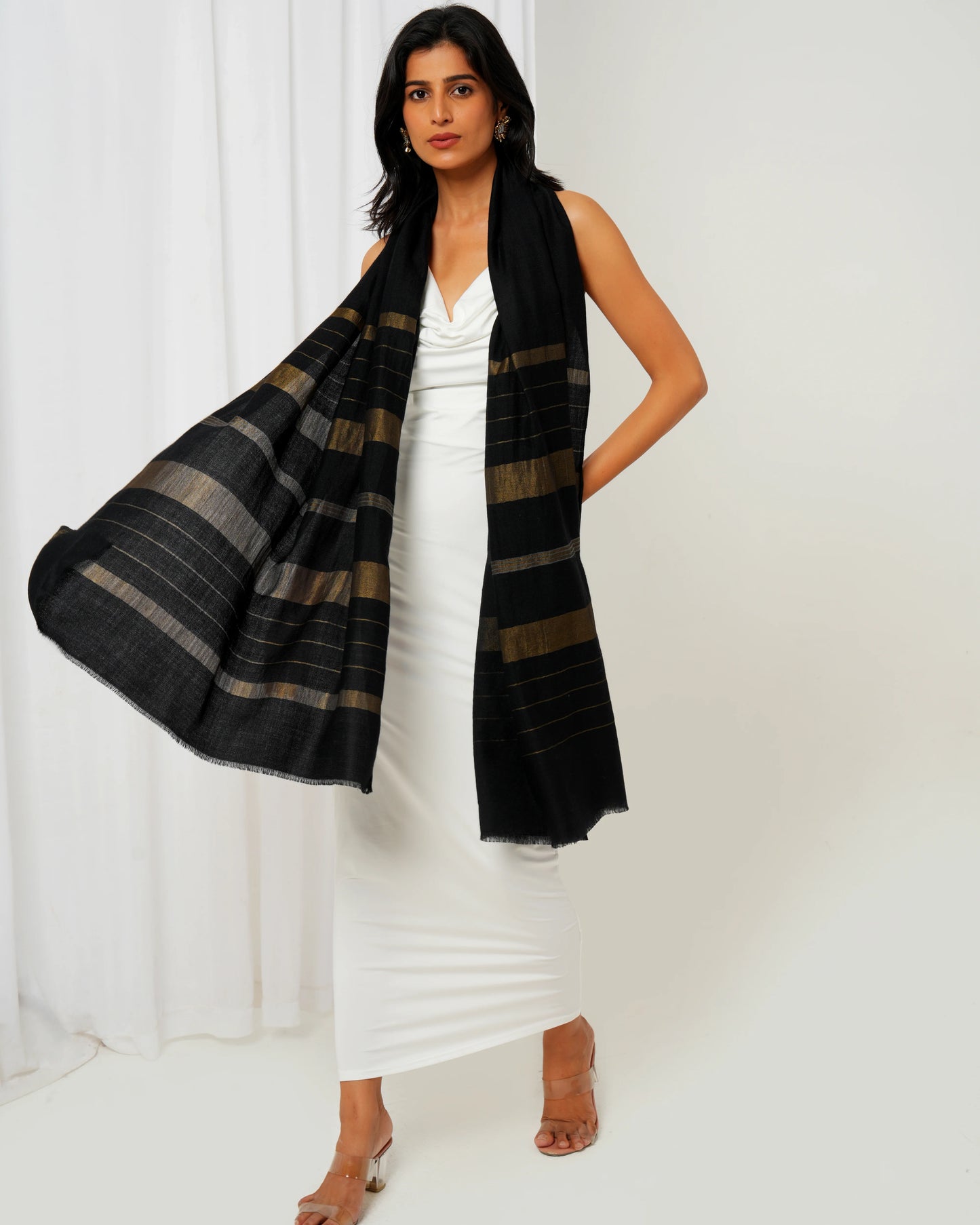Cashmere stole in black base and multi shaped stripes in golden