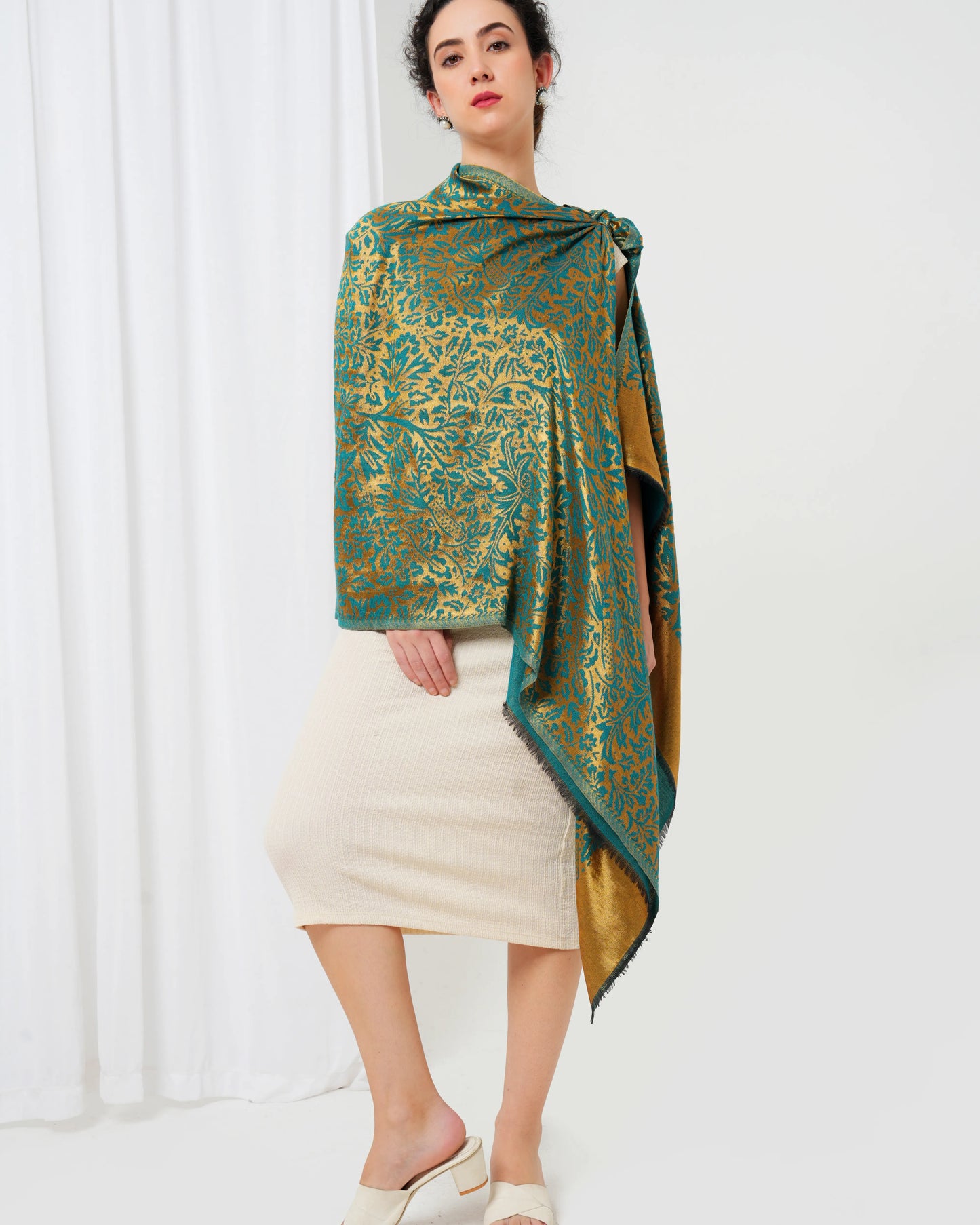 Wool stole with teal blue base with golden design