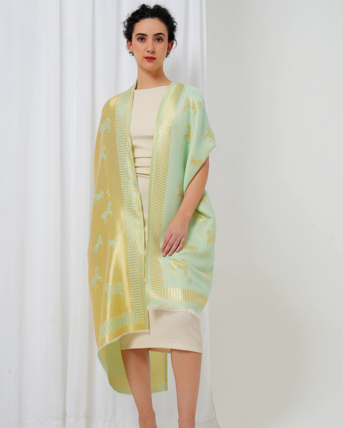 Woolen stole in gold and lime green with horse motifs