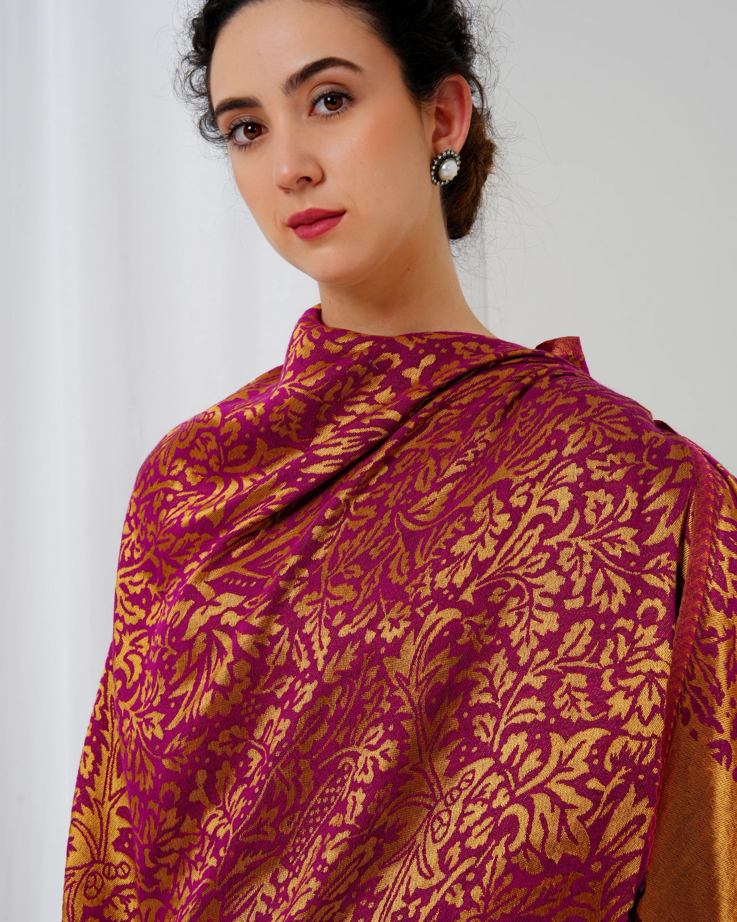 Wool stole with magenta base with golden design