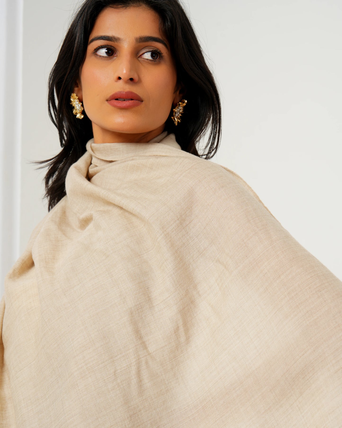 Cashmere stole in cream base with golden stripes